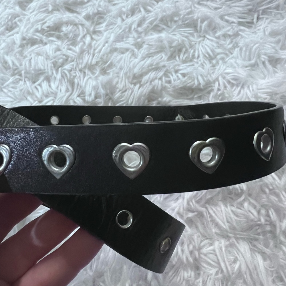 Pleather belt with cute heart holes.